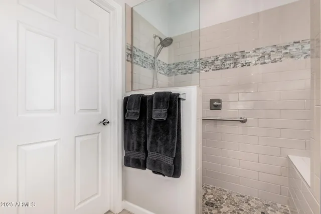a view of a patio with couches chairs potted plants and a table and chairs