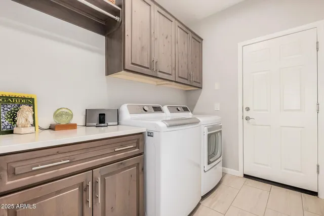 a front view of a house with a yard table and chairs