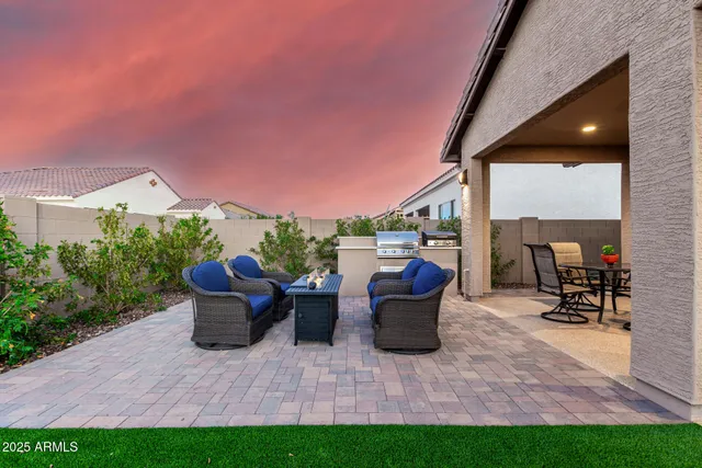 an aerial view of a house with a yard and potted plants