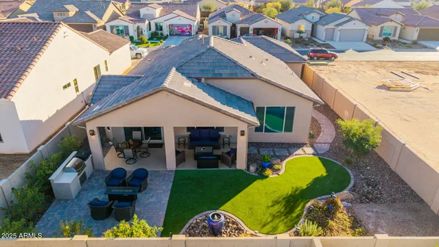 a view of a swimming pool with a yard and plants