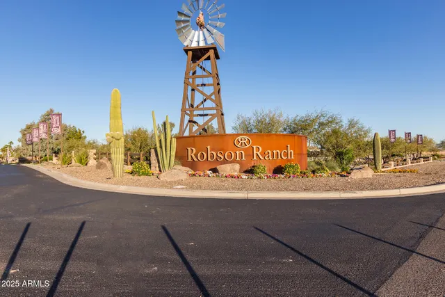 a street sign on a street next to a building