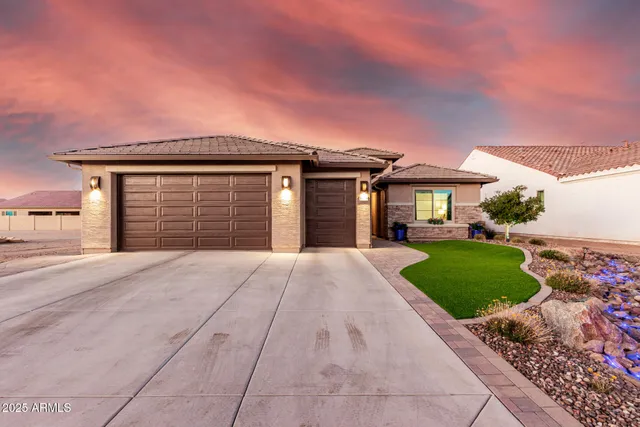 a front view of a house with garden