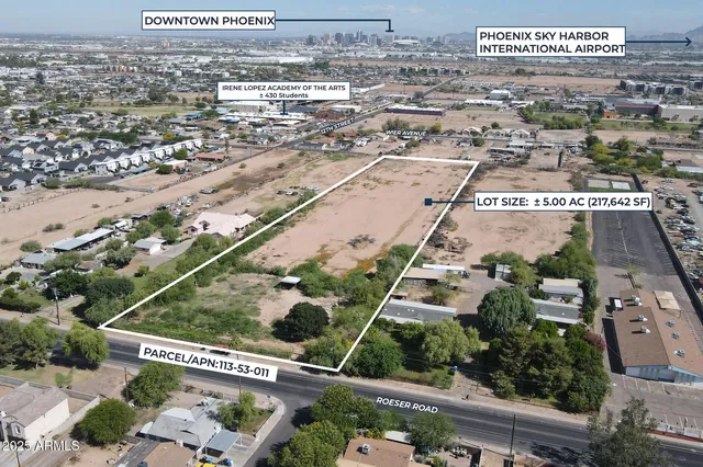 an aerial view of residential houses and lake