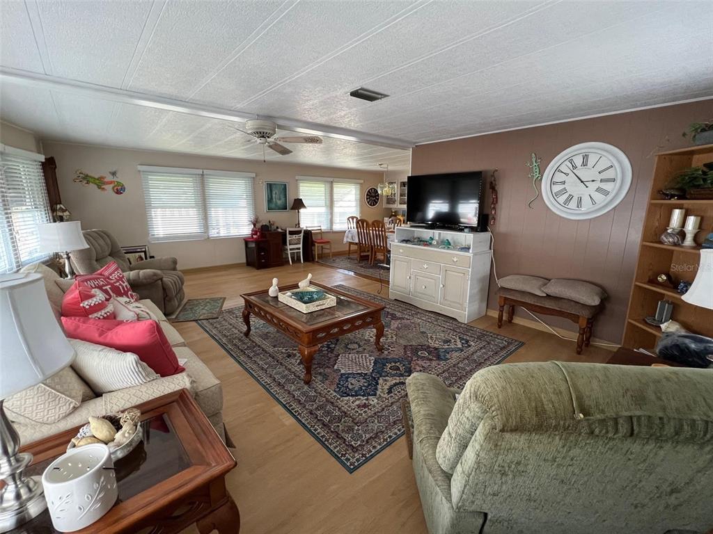 709 Sugar Palm Street Largo, FL 33778 - Photo 13 of 34 a living room with furniture and a flat screen tv