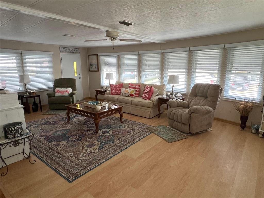 709 Sugar Palm Street Largo, FL 33778 - Photo 15 of 34 a living room with furniture and a large window