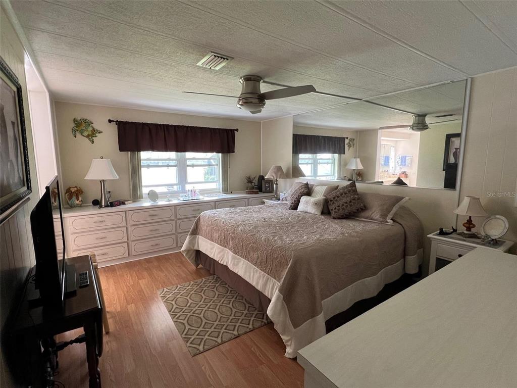 709 Sugar Palm Street Largo, FL 33778 - Photo 16 of 34 a bedroom with a large bed and a window