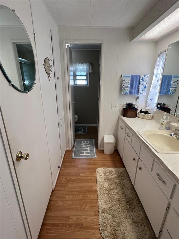 709 Sugar Palm Street Largo, FL 33778 - Photo 20 of 34 a bathroom with a sink a toilet and mirror
