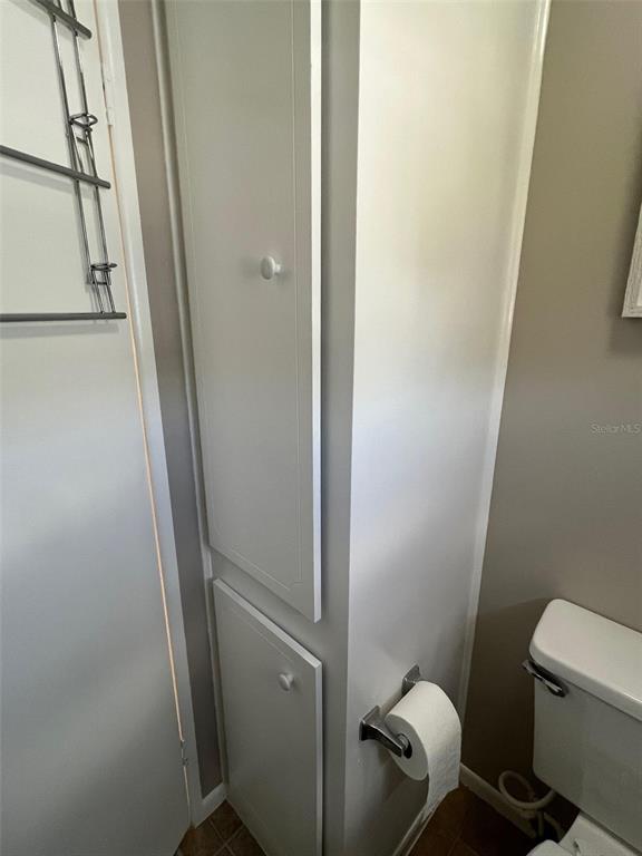 709 Sugar Palm Street Largo, FL 33778 - Photo 23 of 34 a bathroom with a toilet and a shower