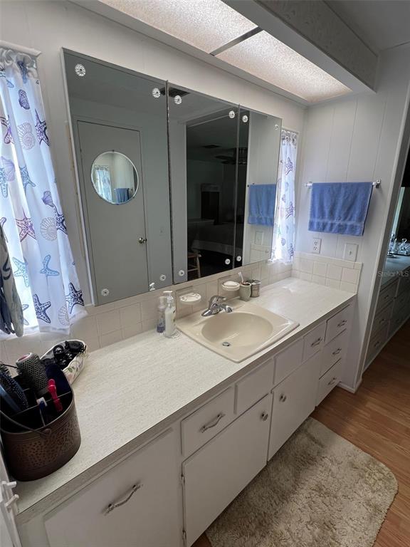 709 Sugar Palm Street Largo, FL 33778 - Photo 25 of 34 a bathroom with a double vanity sink mirror and