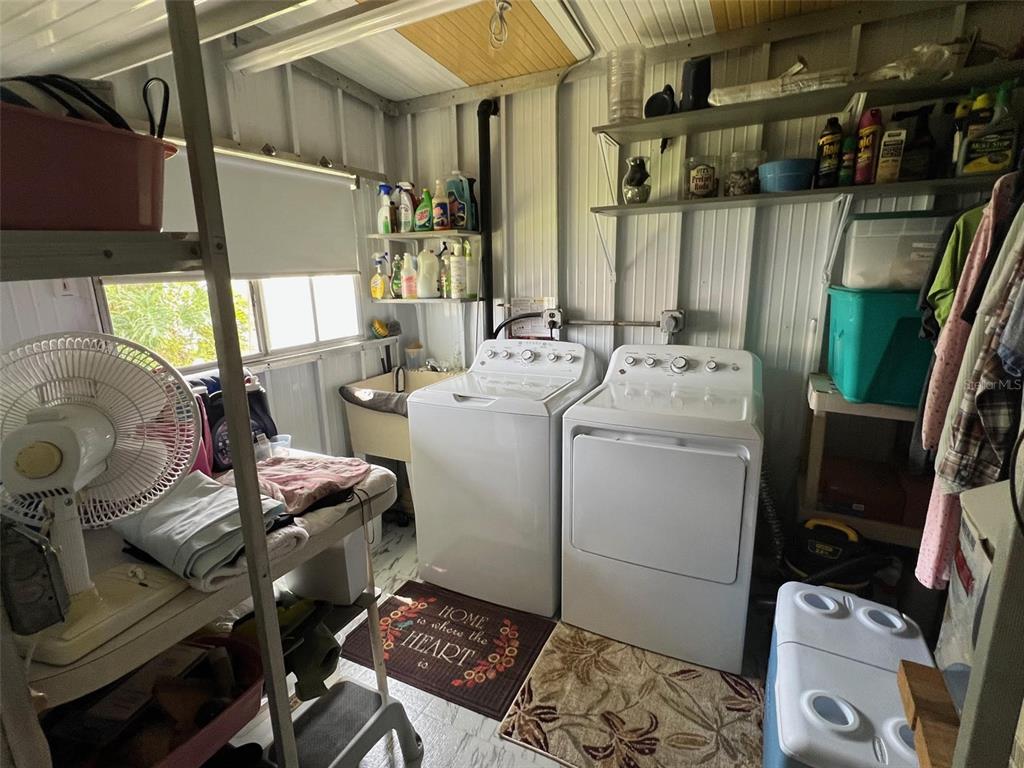 709 Sugar Palm Street Largo, FL 33778 - Photo 33 of 34 a utility room with dryer and washer