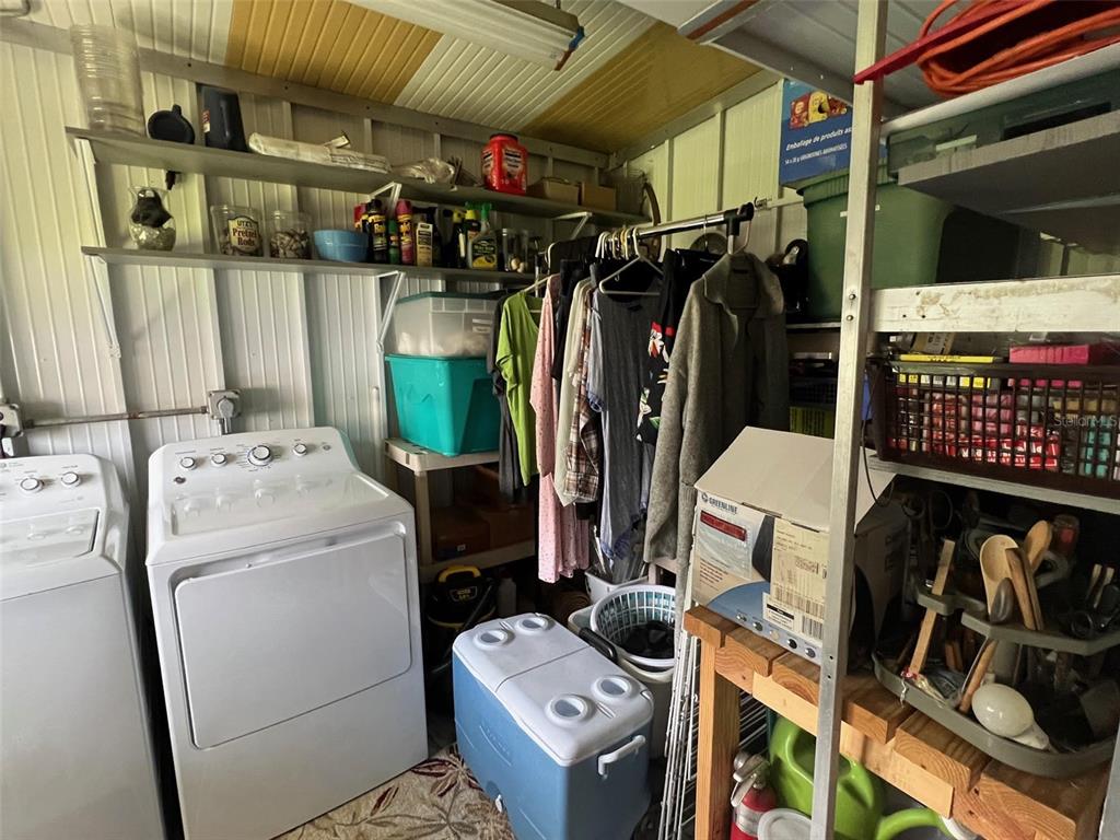 709 Sugar Palm Street Largo, FL 33778 - Photo 34 of 34 a utility room with dryer and washer
