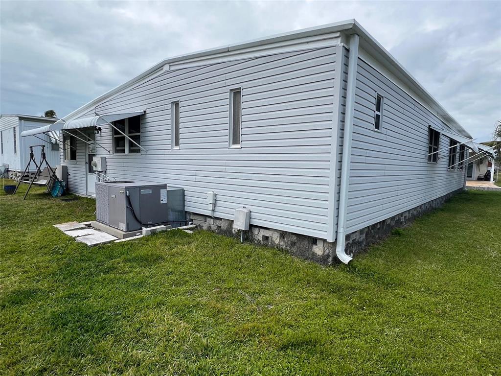 709 Sugar Palm Street Largo, FL 33778 - Photo 5 of 34 a backyard of a house with table and chairs