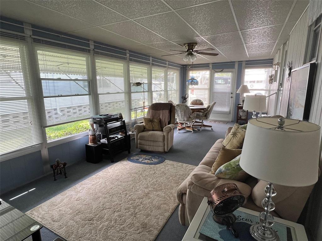 709 Sugar Palm Street Largo, FL 33778 - Photo 8 of 34 a living room with furniture and a large window