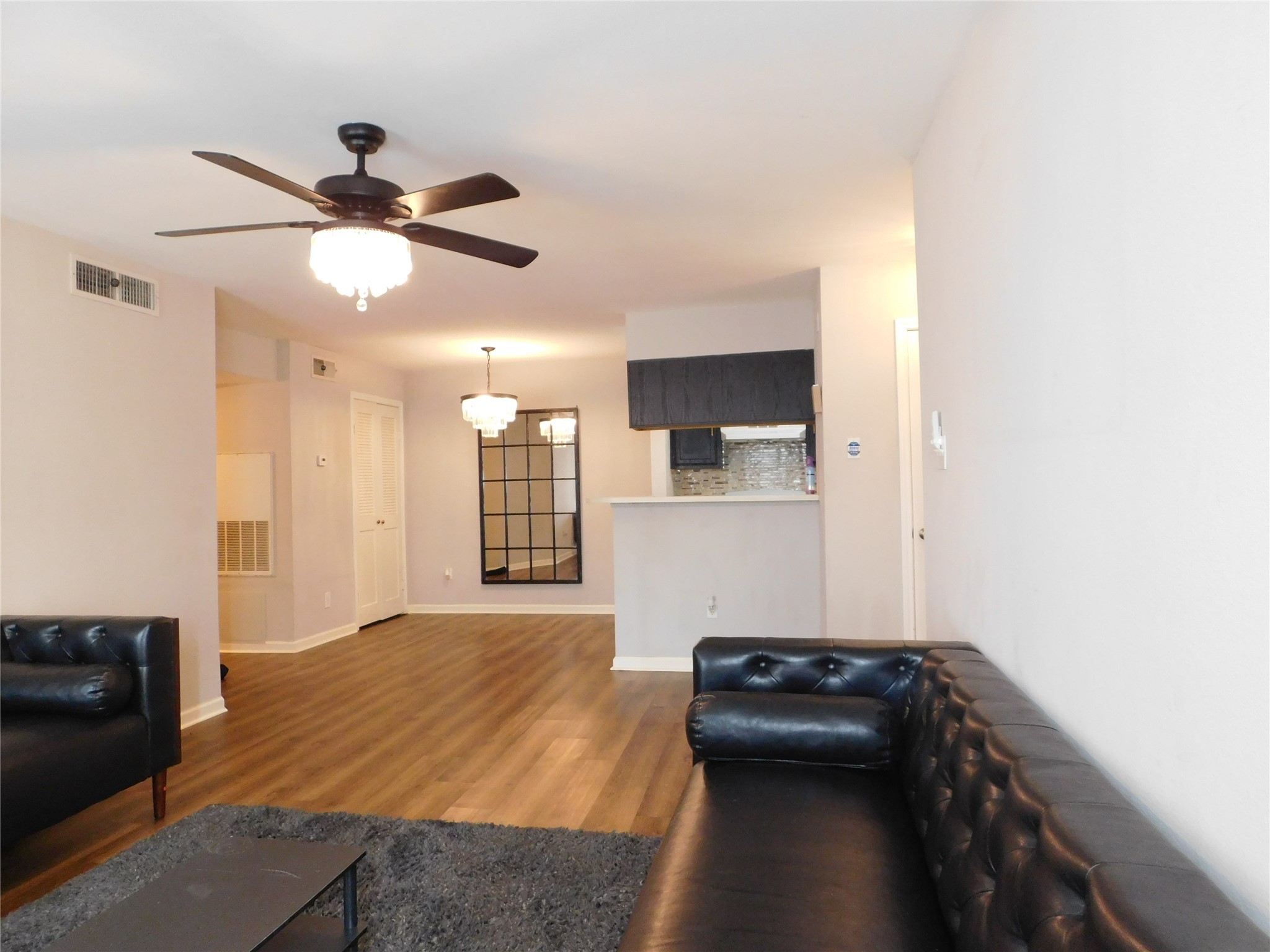 10101 South Gessner Road, Unit 912 Houston, TX 77071 - Photo 3 of 47 a bedroom with a bed and a ceiling fan