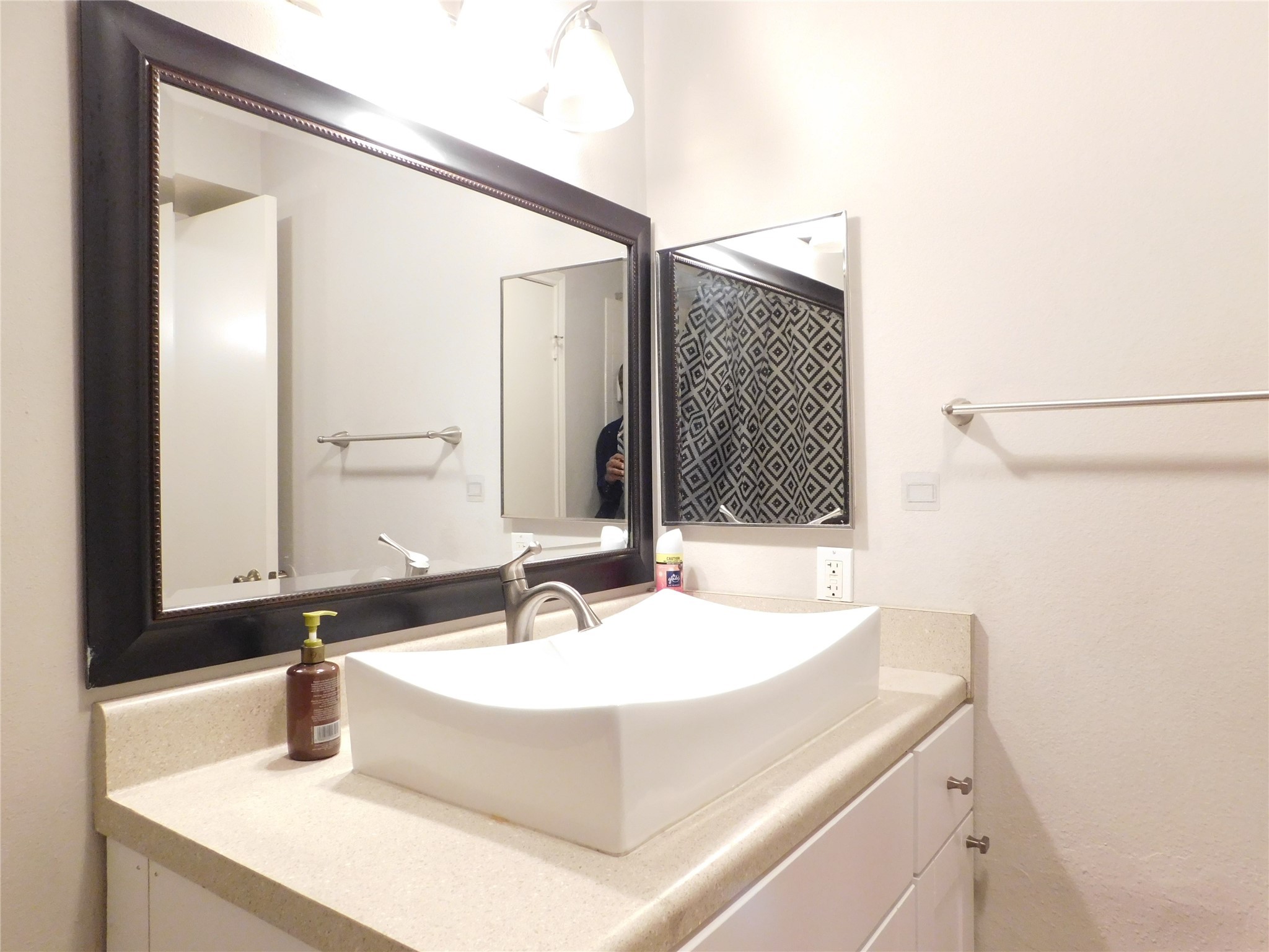 10101 South Gessner Road, Unit 912 Houston, TX 77071 - Photo 32 of 47 a bathroom with a sink and a mirror