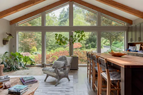 a view of a dining room with furniture window and outside view