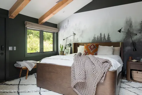 a bedroom with a bed and window
