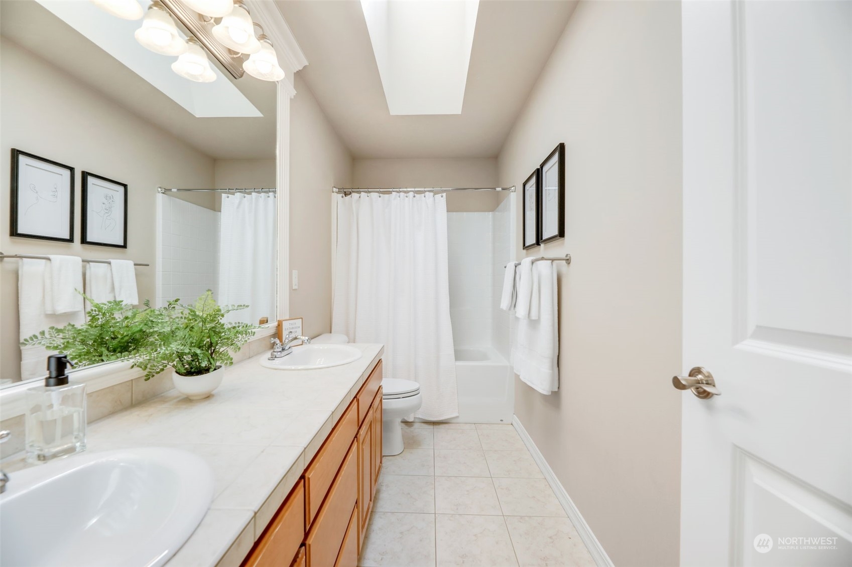 4013 214th Street Southeast Bothell, WA 98021 - Photo 31 of 40 a bathroom with sink and shower