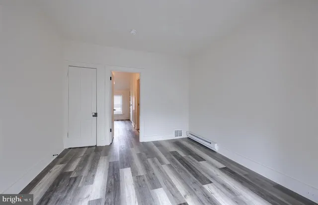 a view of wooden floor in an empty room