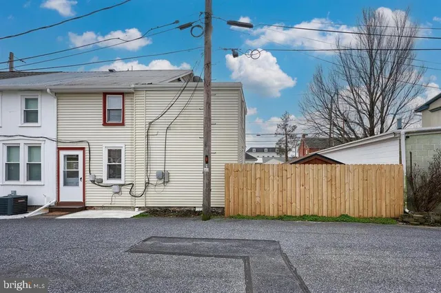 a view of a house with a street