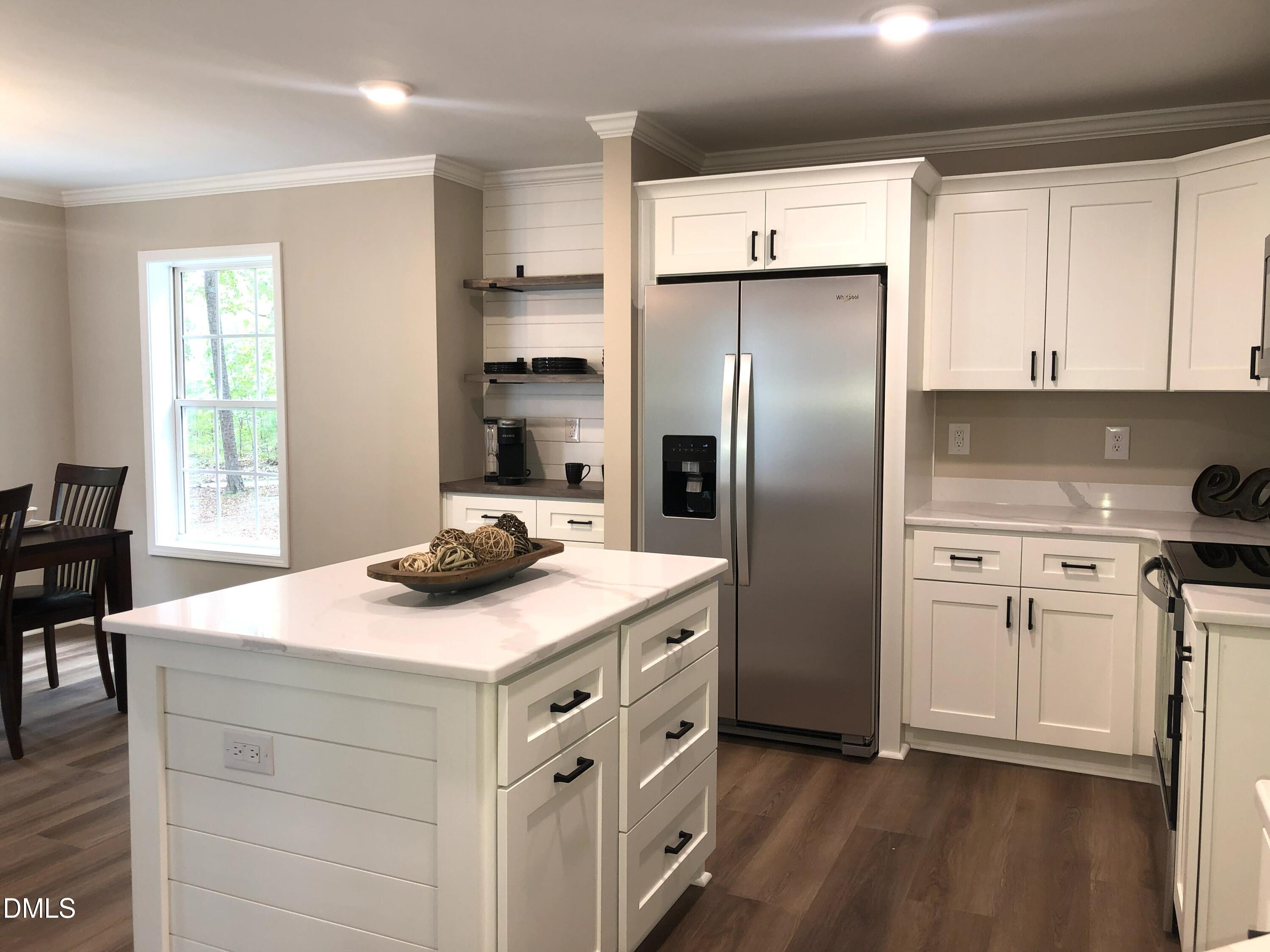 95 Smith Taylor Trail Roxboro, NC 27574 - Photo 18 of 47 a kitchen with a sink cabinets and stainless steel appliances