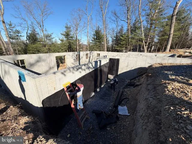 a view of balcony with furniture and trees