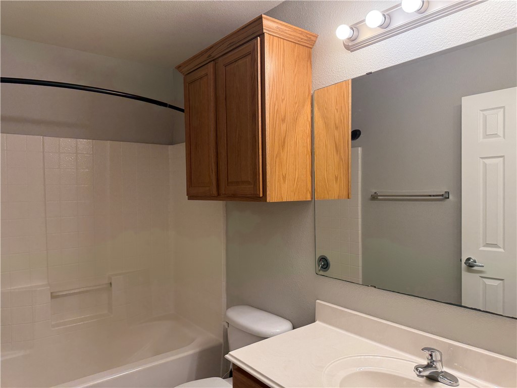 1001 Krenek Tap Road, Unit 2405 College Station, TX 77840 - Photo 12 of 24 a bathroom with a sink and a mirror