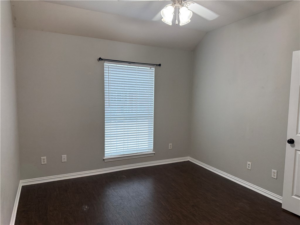 1001 Krenek Tap Road, Unit 2405 College Station, TX 77840 - Photo 14 of 24 an empty room with wooden floor and windows