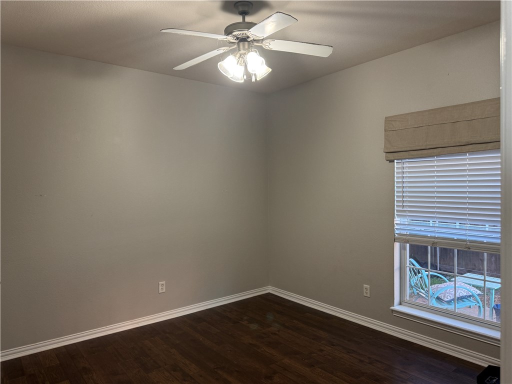1001 Krenek Tap Road, Unit 2405 College Station, TX 77840 - Photo 15 of 24 a view of an empty room with wooden floor and a window