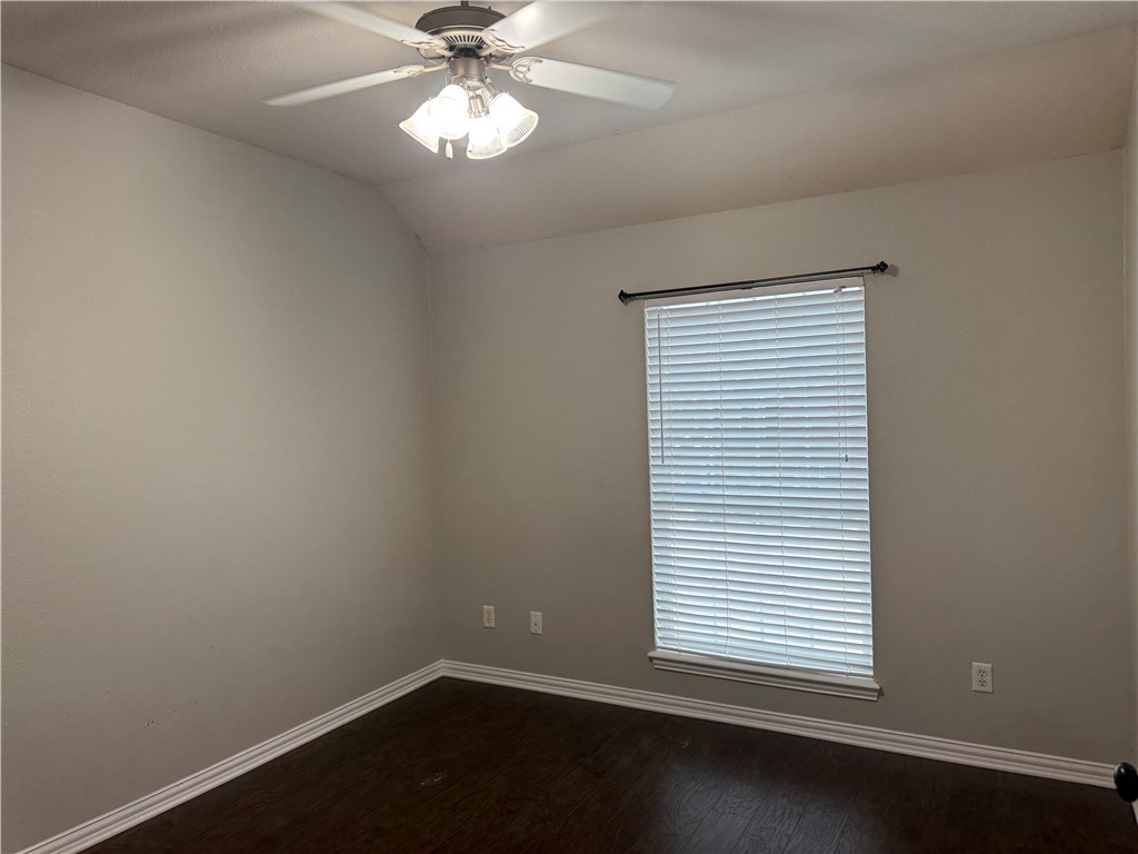 1001 Krenek Tap Road, Unit 2405 College Station, TX 77840 - Photo 17 of 24 an empty room with a window and a fan