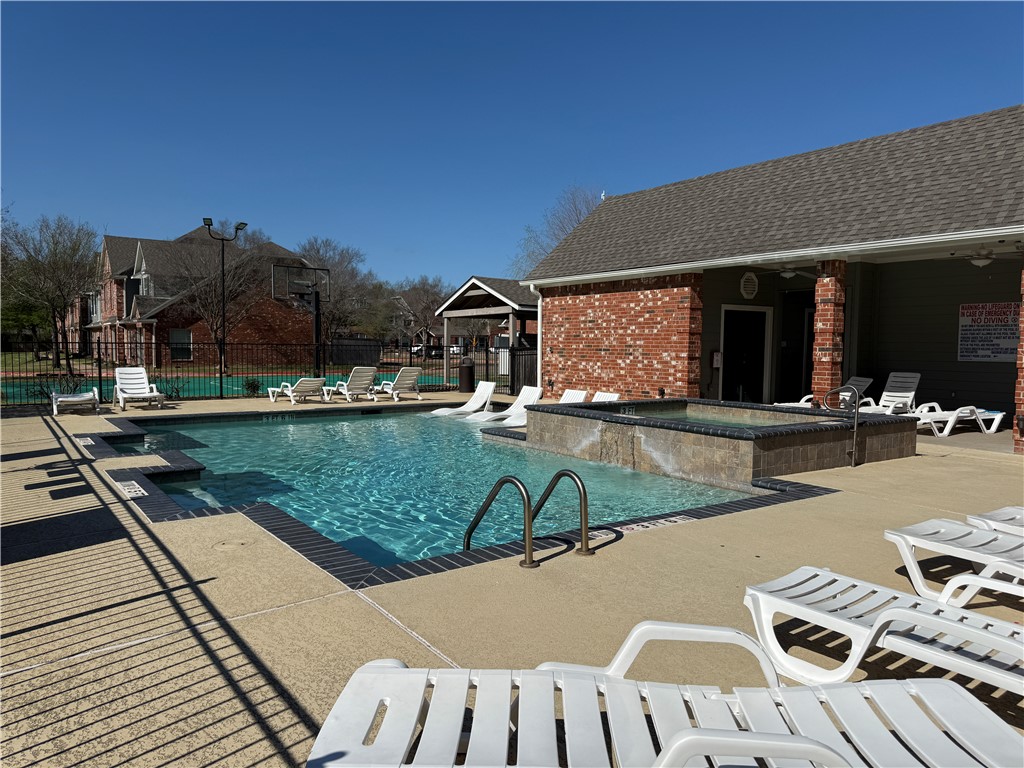 1001 Krenek Tap Road, Unit 2405 College Station, TX 77840 - Photo 21 of 24 a view of a swimming pool with a patio
