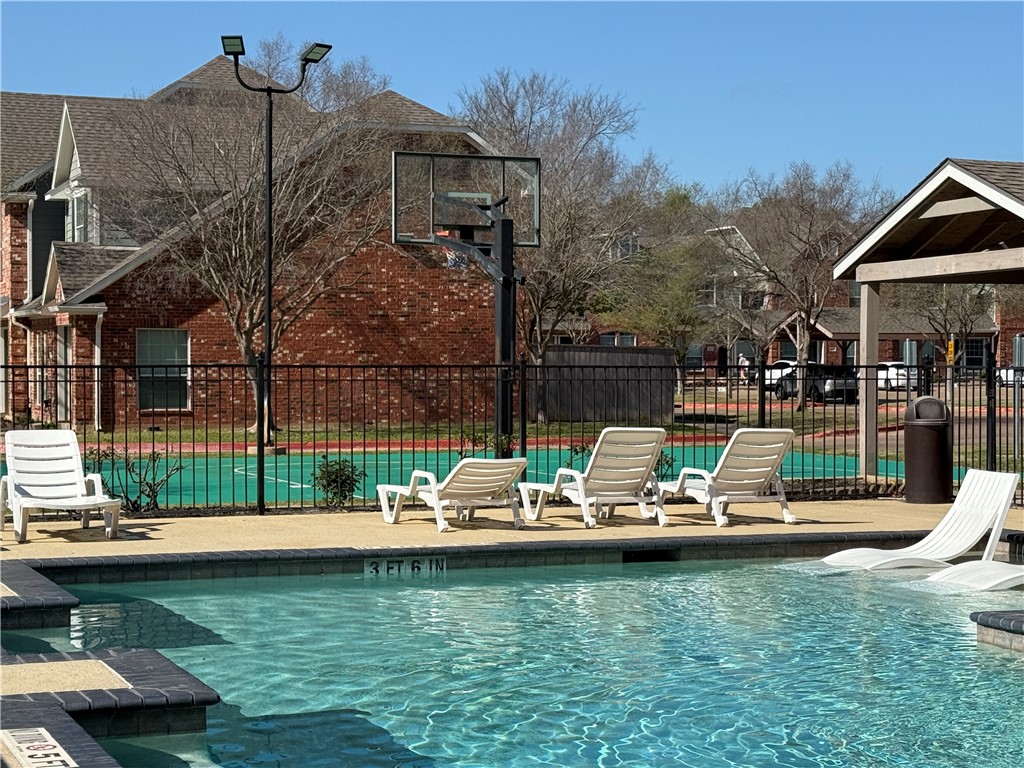 1001 Krenek Tap Road, Unit 2405 College Station, TX 77840 - Photo 22 of 24 a view of a house with a yard patio and swimming pool