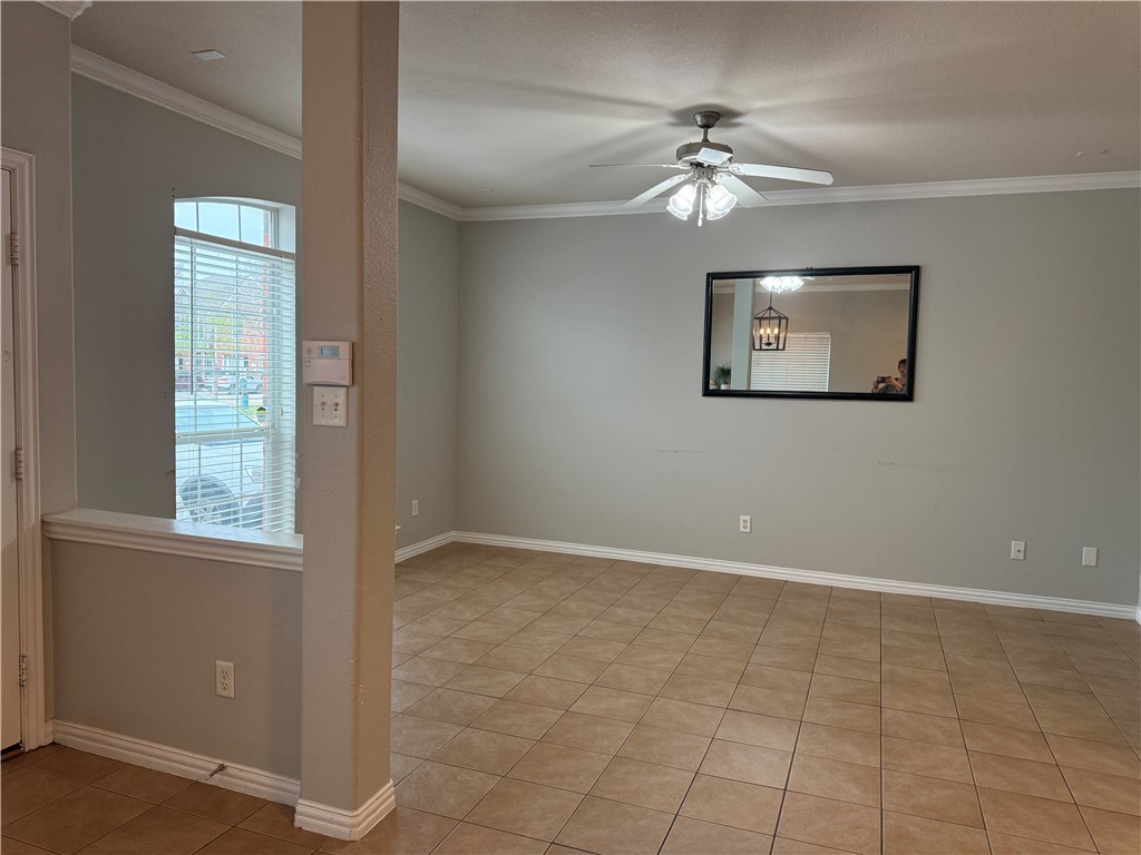 1001 Krenek Tap Road, Unit 2405 College Station, TX 77840 - Photo 3 of 24 an empty room with windows and fan