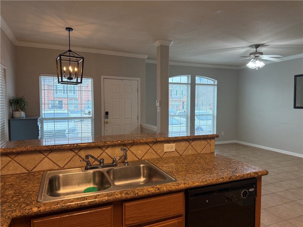 1001 Krenek Tap Road, Unit 2405 College Station, TX 77840 - Photo 7 of 24 a kitchen with a sink and a window