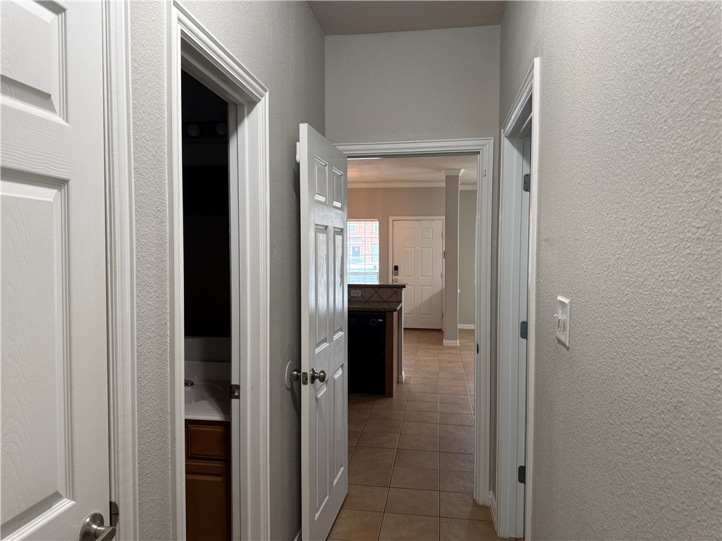 1001 Krenek Tap Road, Unit 2405 College Station, TX 77840 - Photo 10 of 24 a view of a bathroom from a hallway