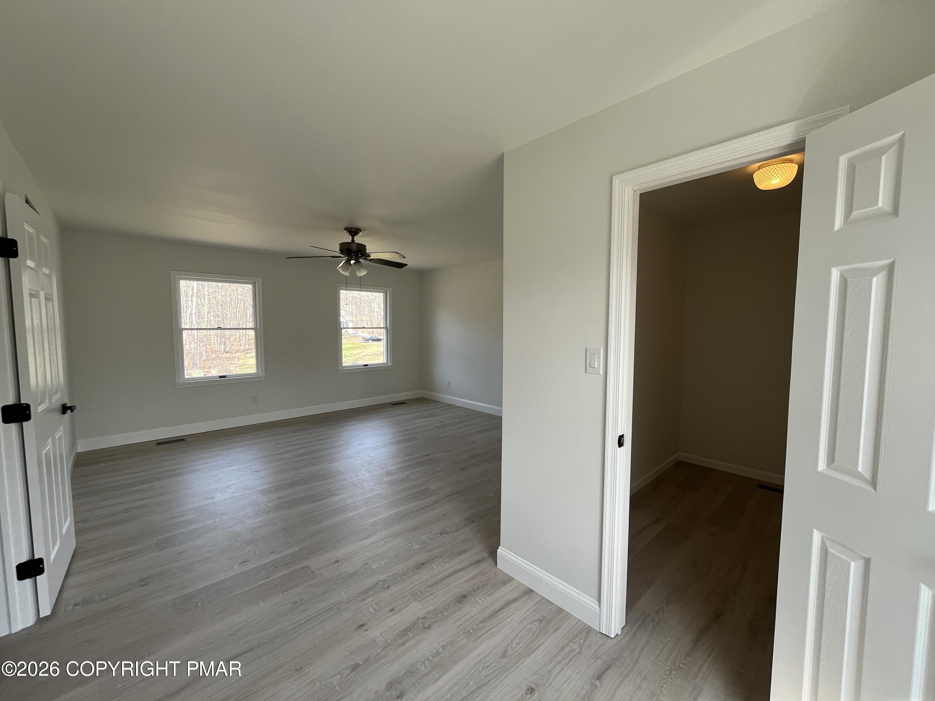 1281 Brian Lane Effort, PA 18330 - Photo 19 of 32 an empty room with wooden floor and windows