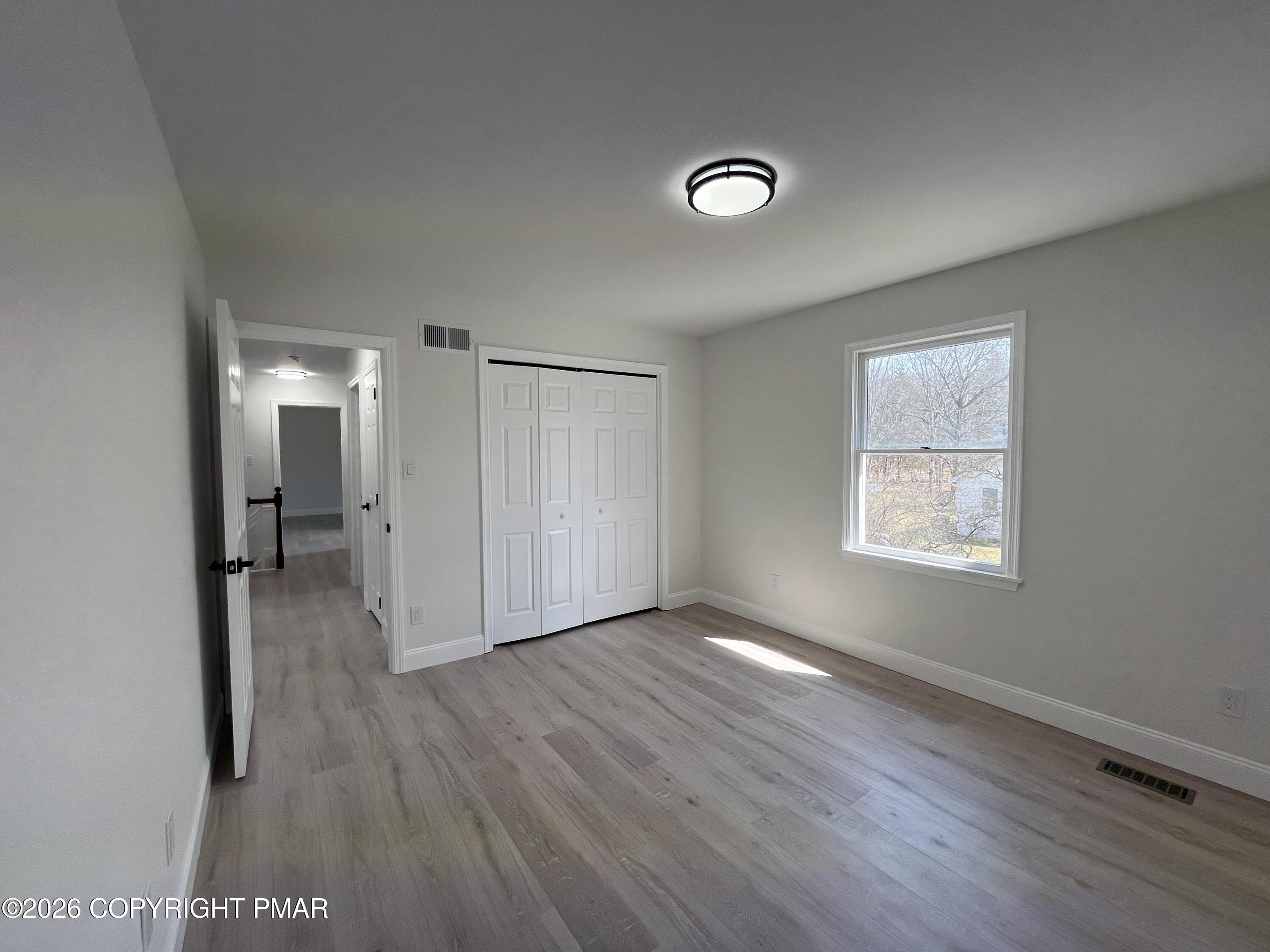 1281 Brian Lane Effort, PA 18330 - Photo 25 of 32 a view of livingroom with hardwood floor and a window