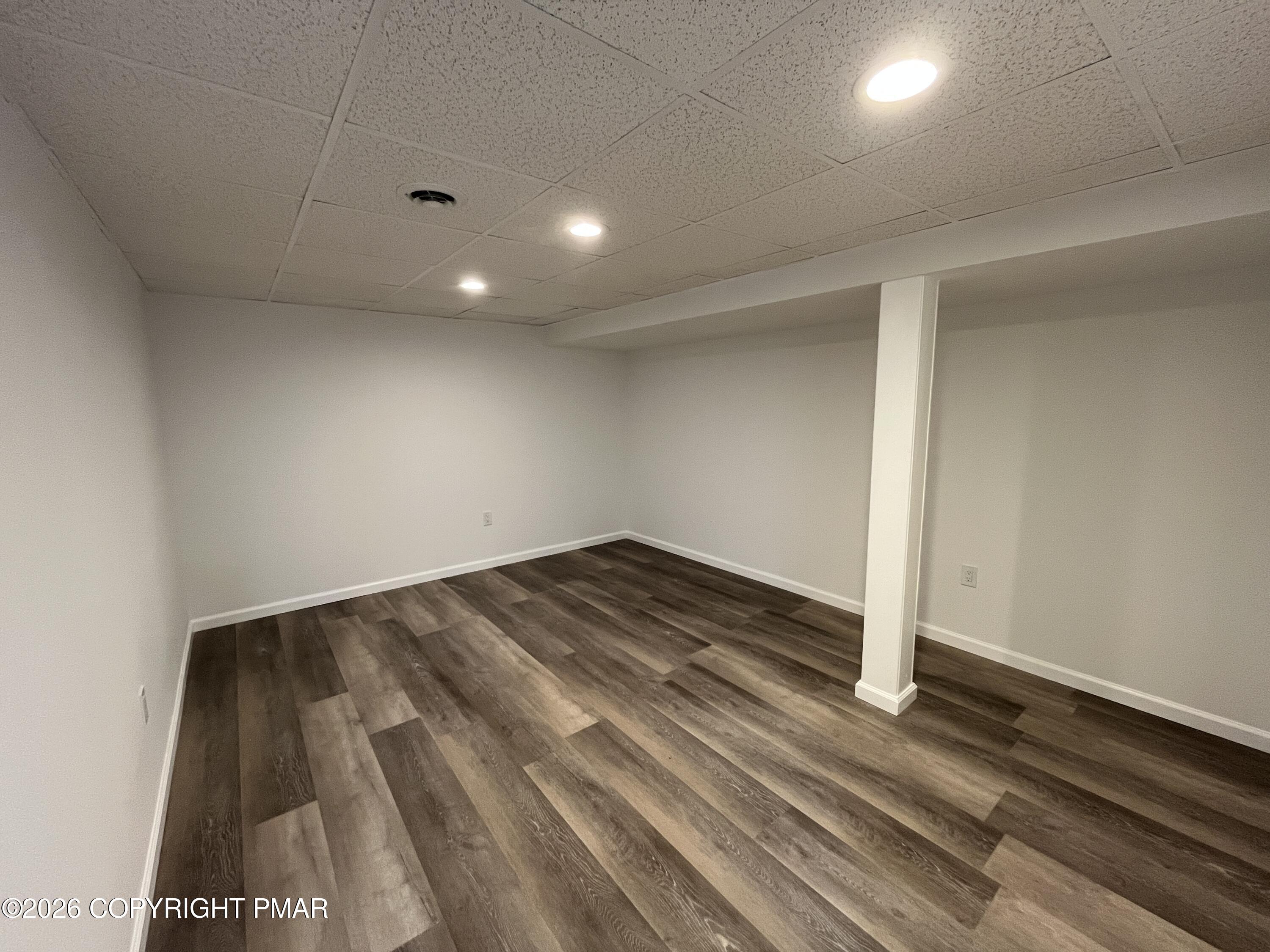 1281 Brian Lane Effort, PA 18330 - Photo 27 of 32 an empty room with wooden floor