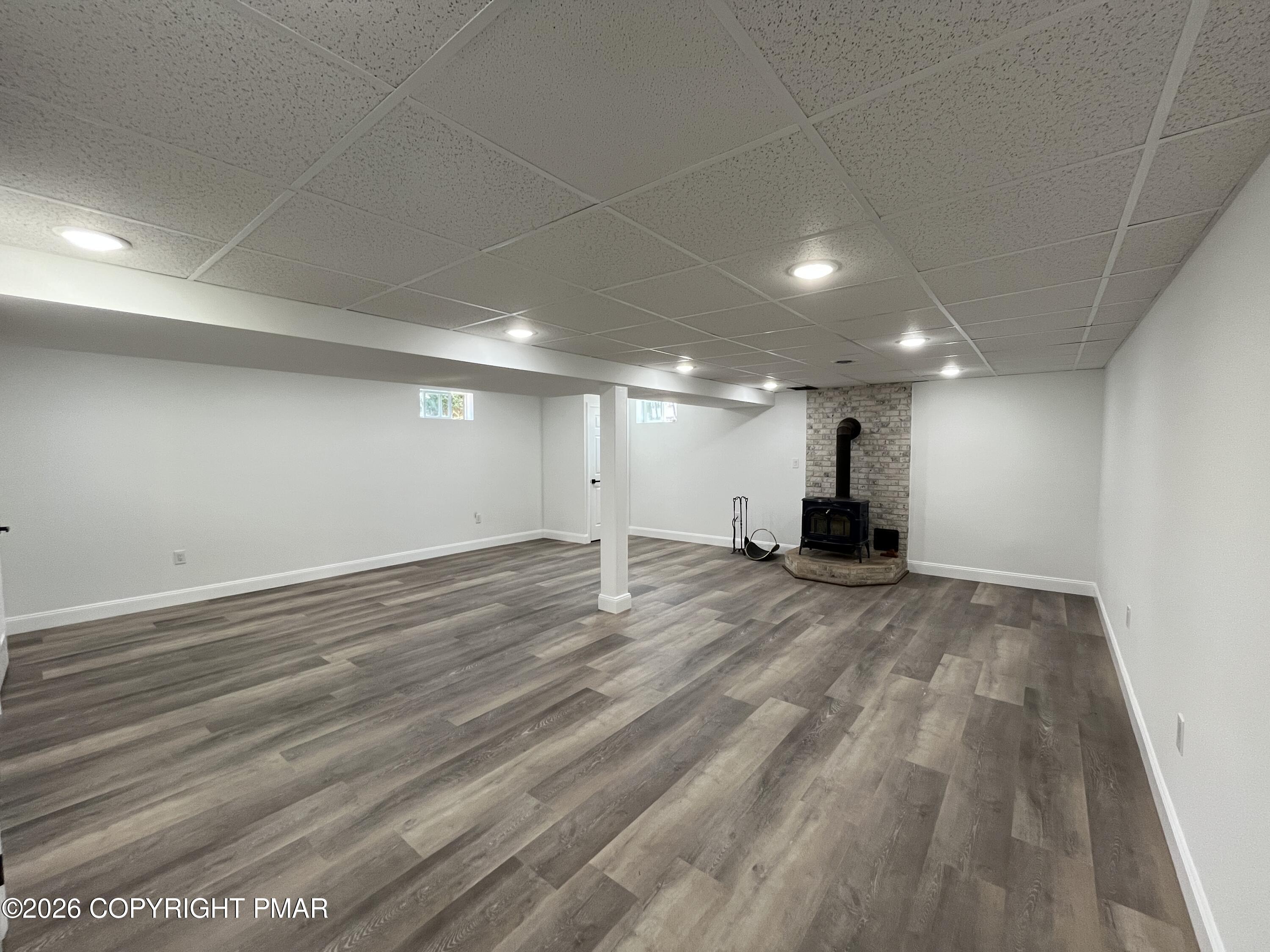 1281 Brian Lane Effort, PA 18330 - Photo 28 of 32 an empty room with wooden floor and windows