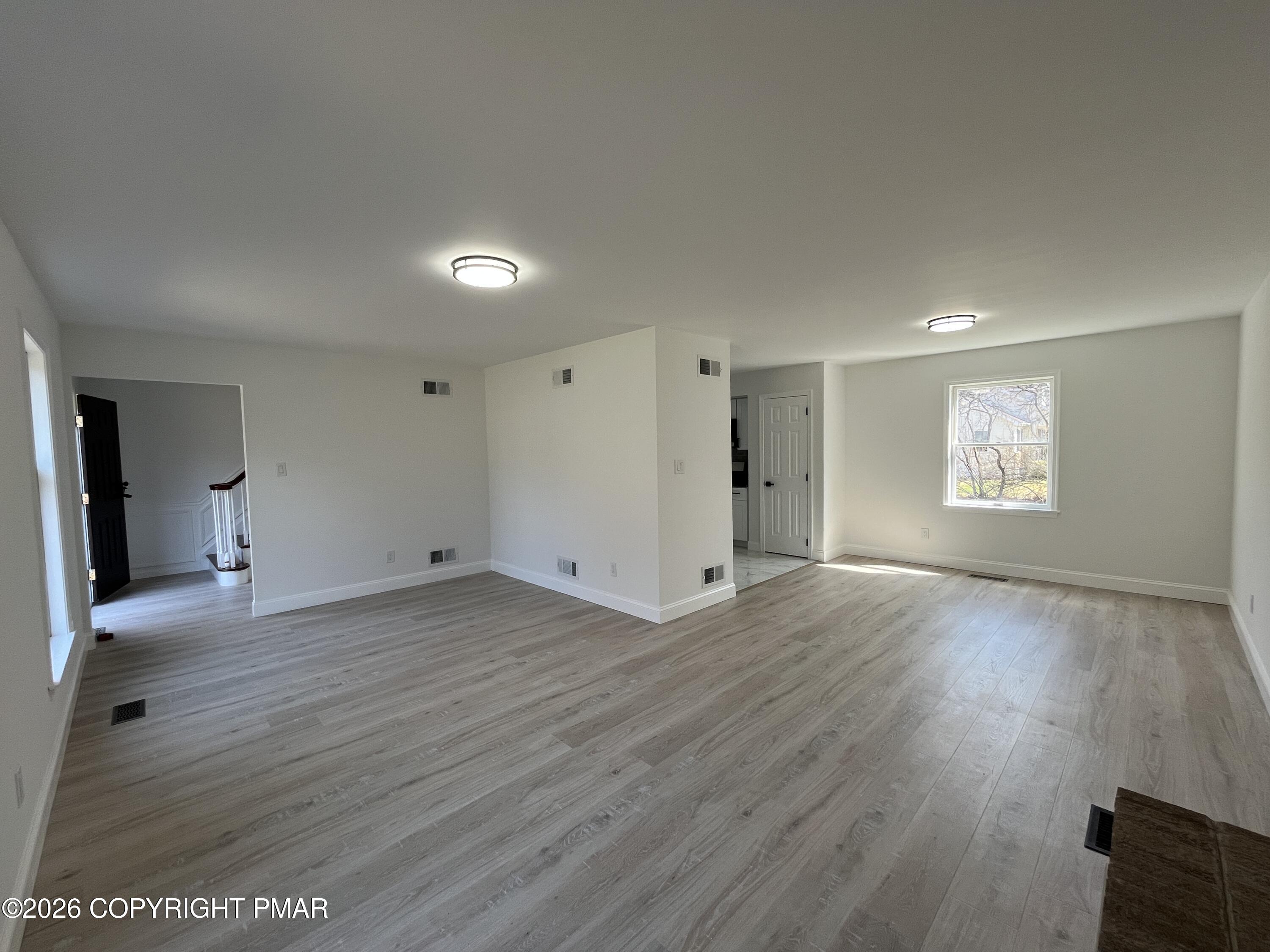 1281 Brian Lane Effort, PA 18330 - Photo 5 of 32 a view of empty room with window and wooden floor