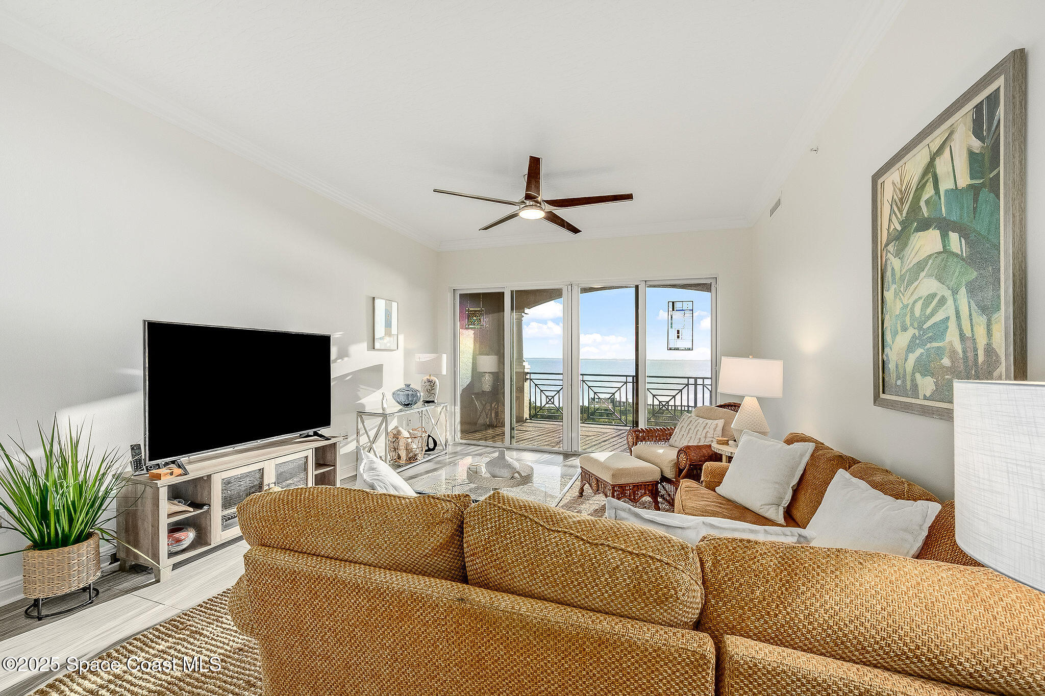 2012 Julep Drive, Unit 304 Cocoa Beach, FL 32931 - Photo 12 of 67 a living room with furniture and a flat screen tv