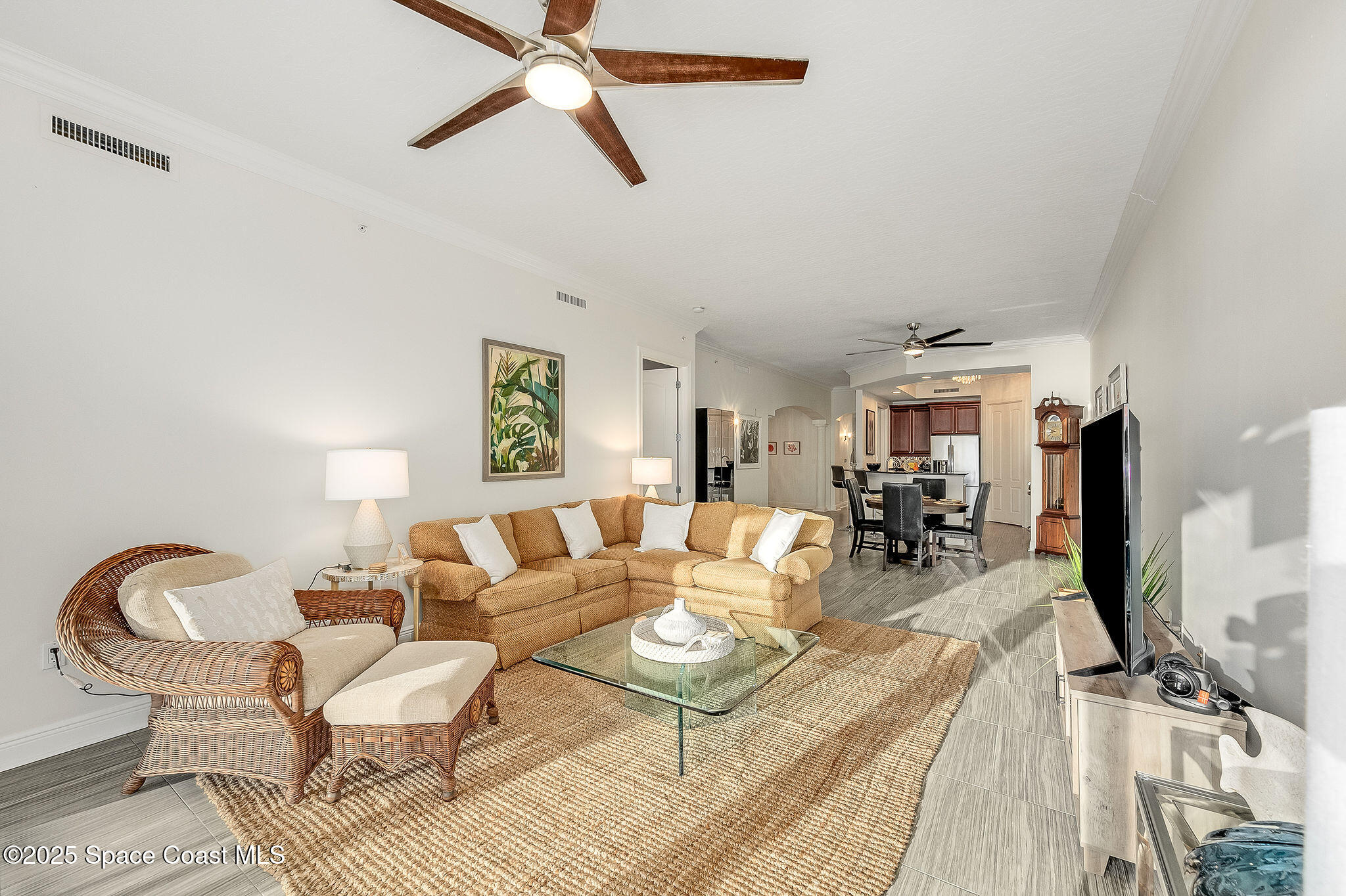 2012 Julep Drive, Unit 304 Cocoa Beach, FL 32931 - Photo 14 of 67 a living room with furniture and a flat screen tv