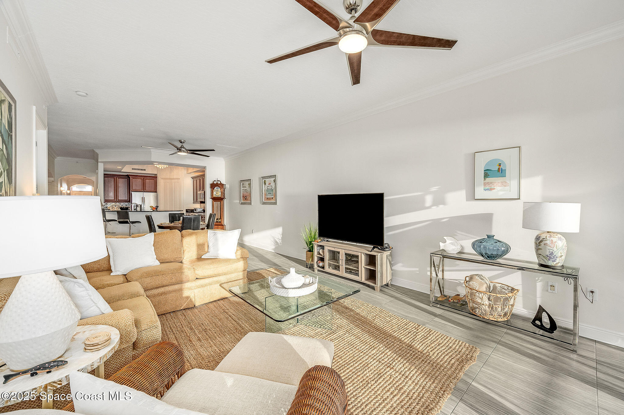 2012 Julep Drive, Unit 304 Cocoa Beach, FL 32931 - Photo 15 of 67 a living room with furniture and a flat screen tv