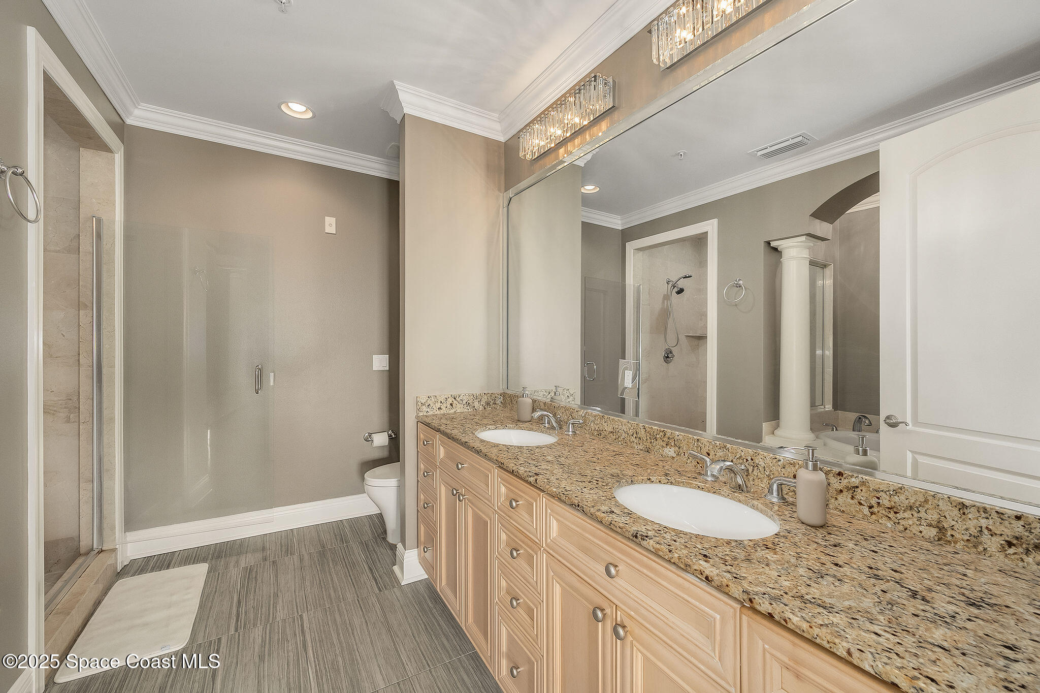 2012 Julep Drive, Unit 304 Cocoa Beach, FL 32931 - Photo 24 of 67 a bathroom with a granite countertop double vanity sink and a mirror