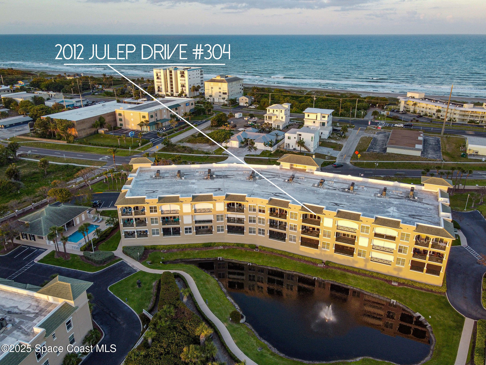2012 Julep Drive, Unit 304 Cocoa Beach, FL 32931 - Photo 3 of 67 a view of a swimming pool with outdoor seating