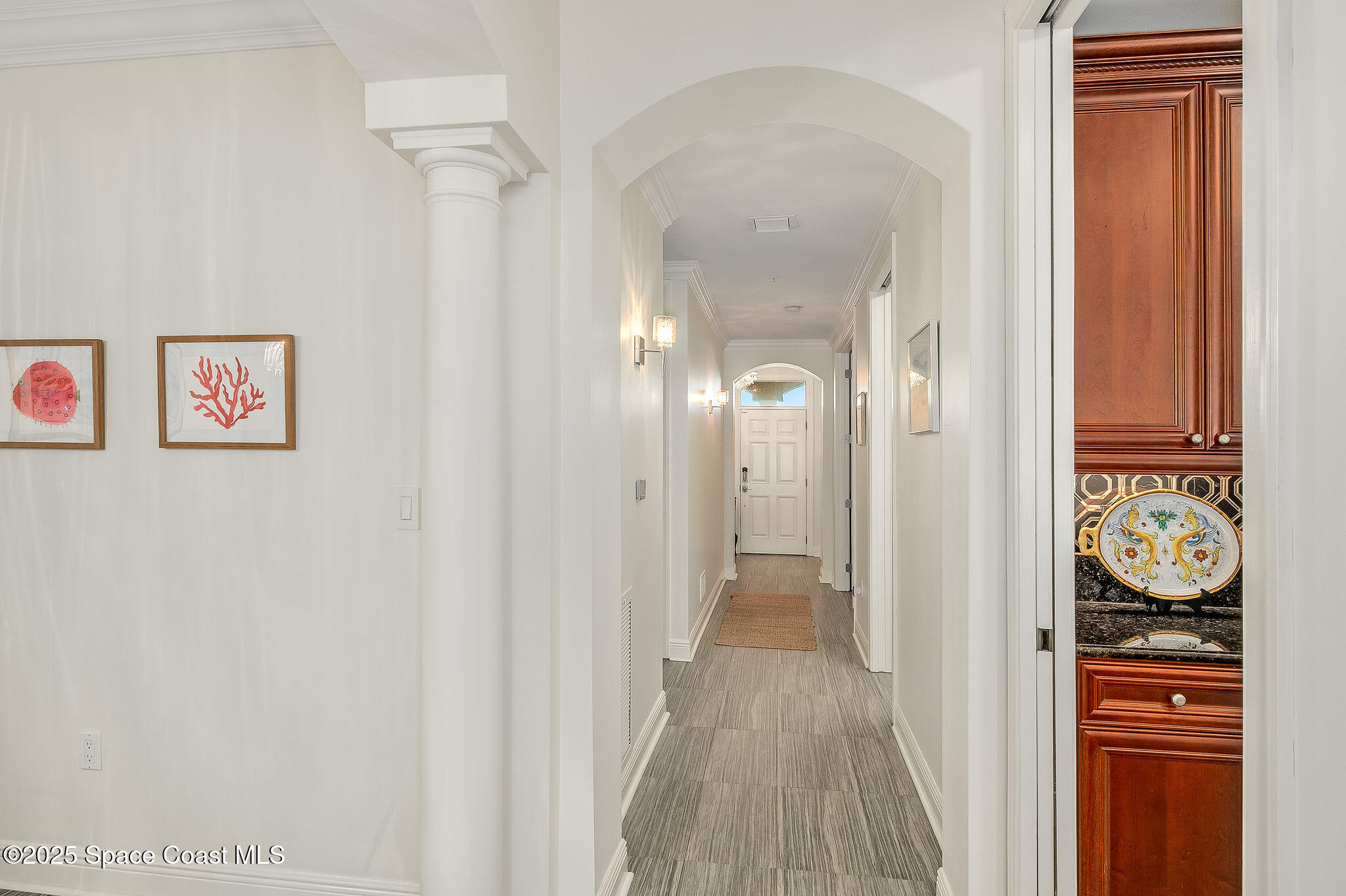 2012 Julep Drive, Unit 304 Cocoa Beach, FL 32931 - Photo 32 of 67 a view of a hallway view with wooden floor