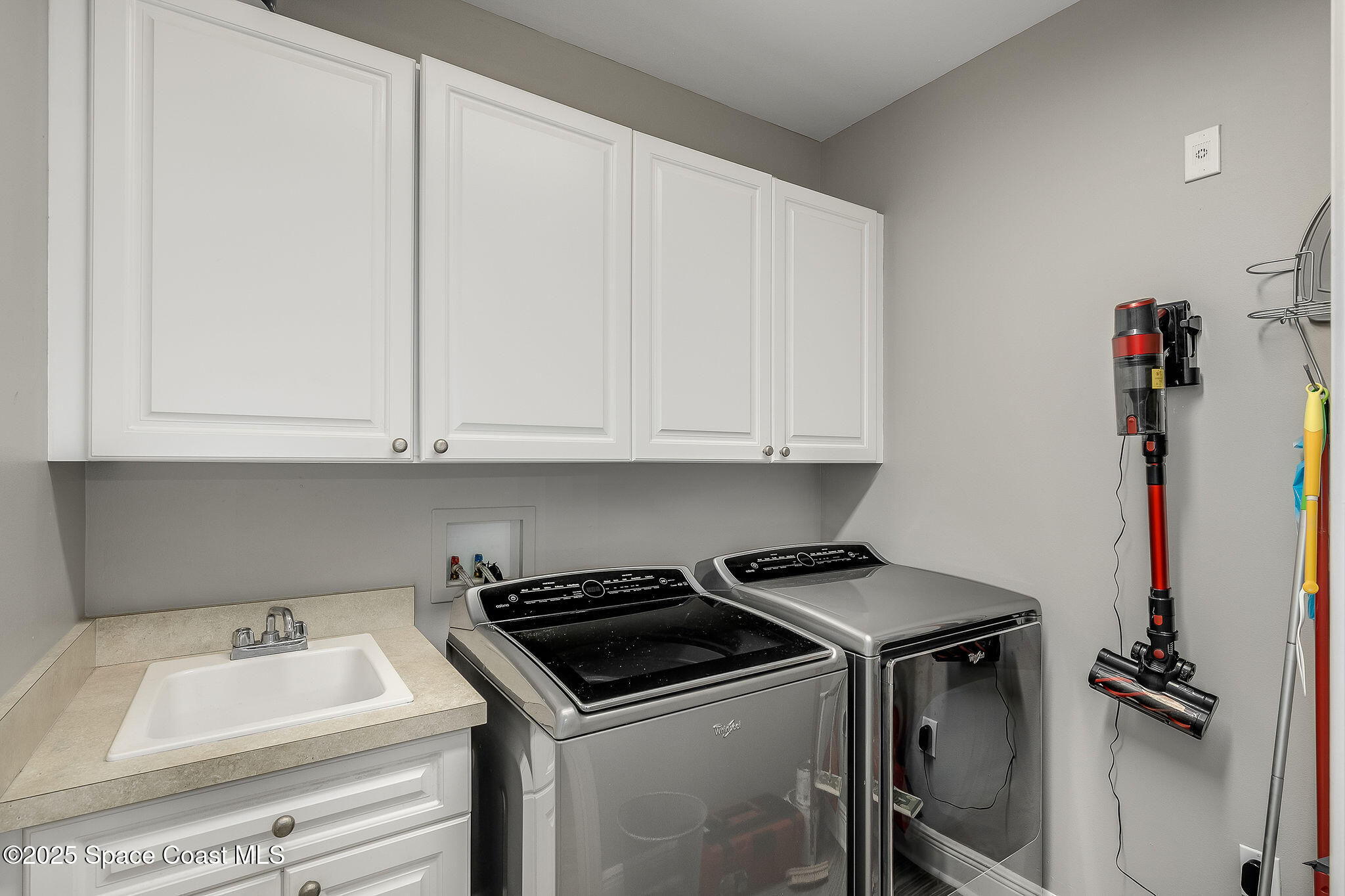 2012 Julep Drive, Unit 304 Cocoa Beach, FL 32931 - Photo 41 of 67 a view of storage and utility room with washer and dryer