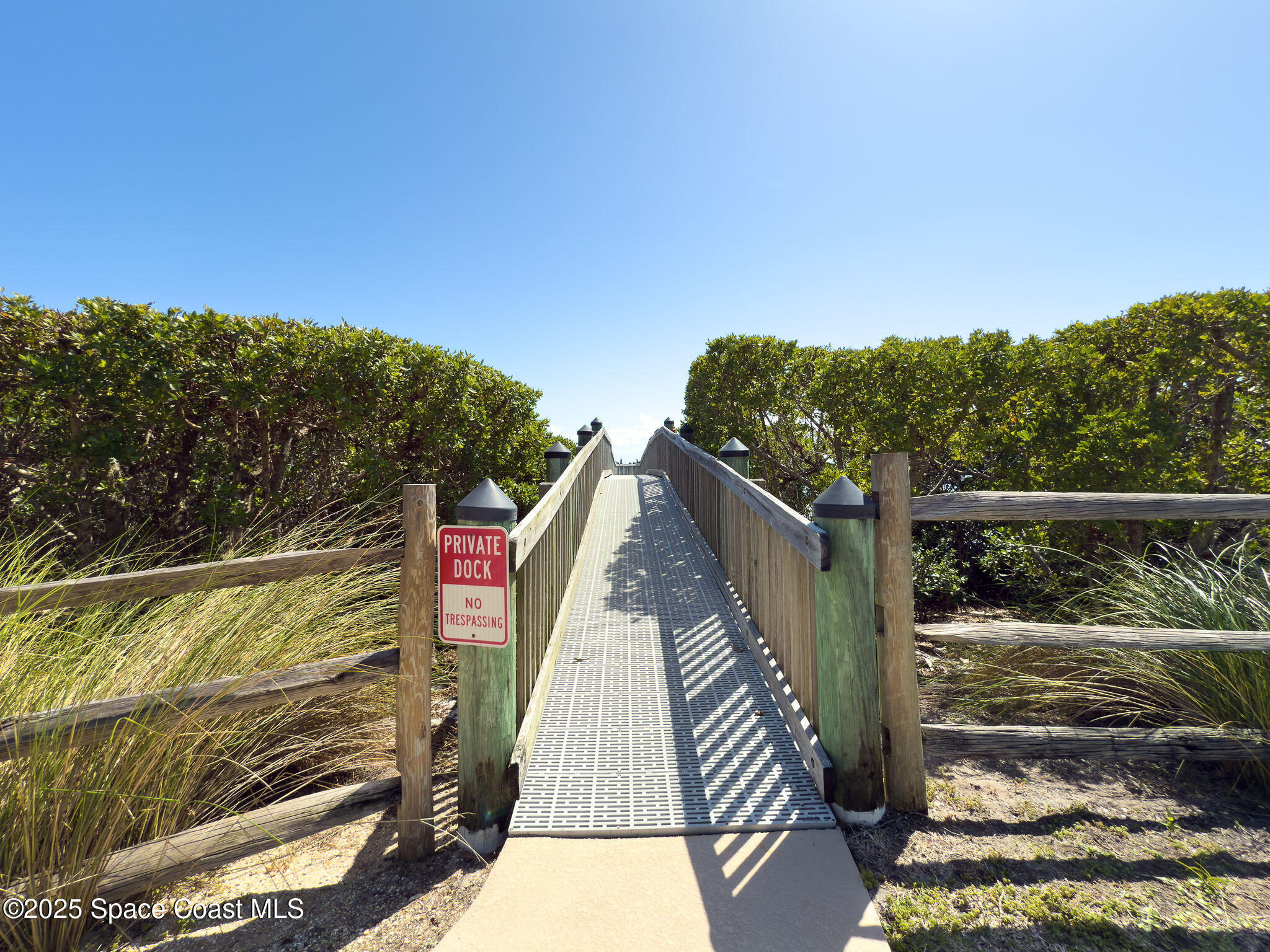 2012 Julep Drive, Unit 304 Cocoa Beach, FL 32931 - Photo 50 of 67 a view of balcony with wooden floor and fence