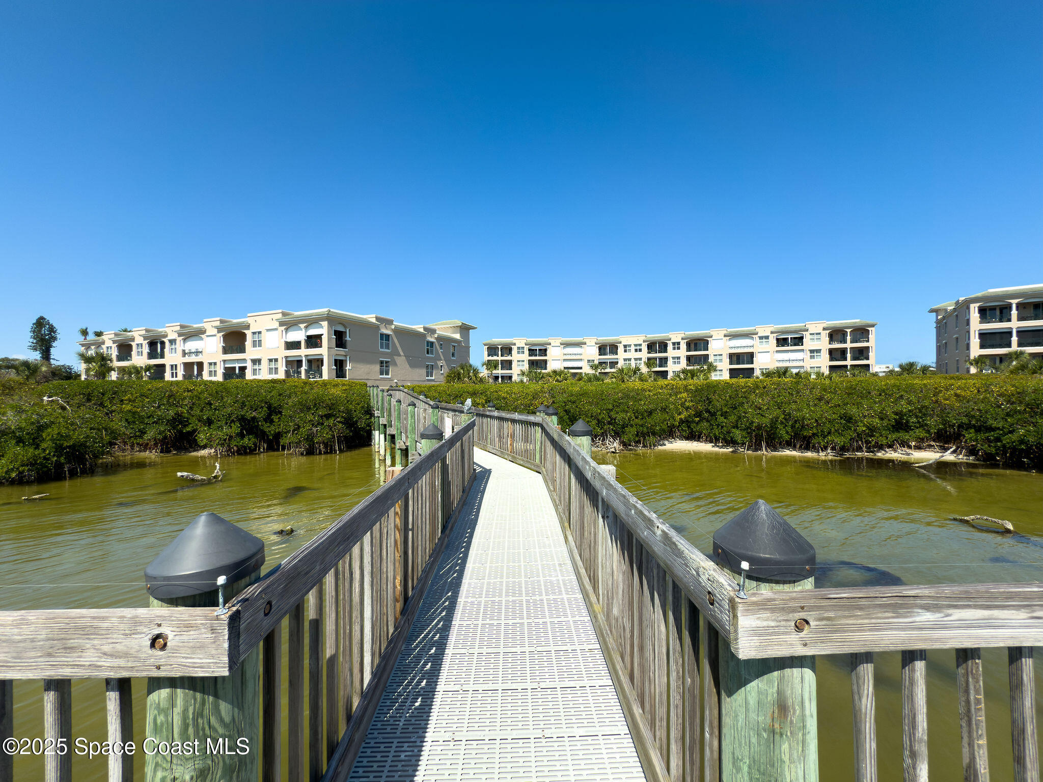 2012 Julep Drive, Unit 304 Cocoa Beach, FL 32931 - Photo 52 of 67 a view of a city and swimming pool
