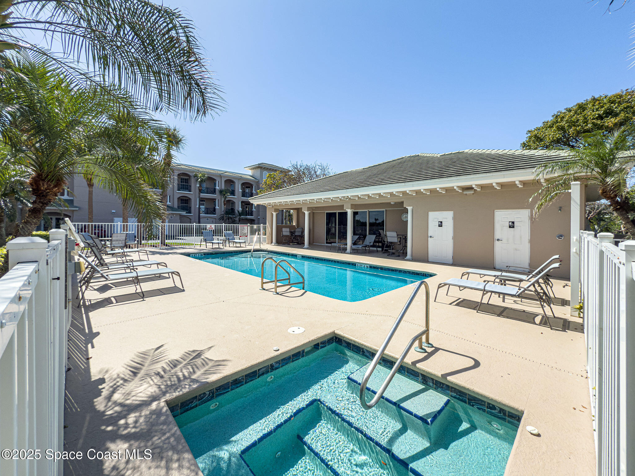 2012 Julep Drive, Unit 304 Cocoa Beach, FL 32931 - Photo 55 of 67 a view of a house with swimming pool and sitting area